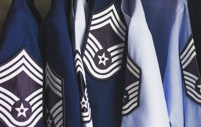 Photo of uniforms displaying rank on Air Force sleeves