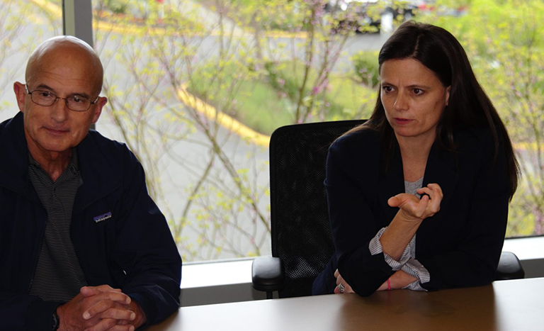 Microsoft CFO Amy Hood and Microsoft Vice President of Military Affairs Chris Cortez listen to National Guard and Reserve members share their stories of serving in the armed forces.