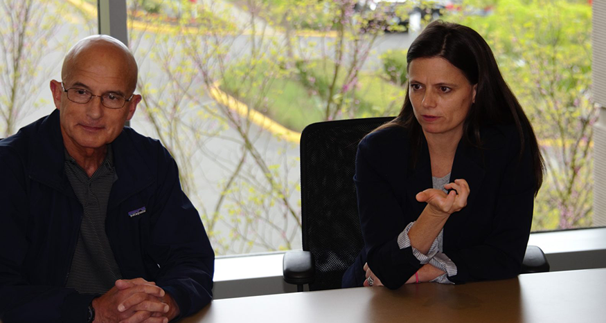 Microsoft CFO Amy Hood and Microsoft Vice President of Military Affairs Chris Cortez listen to National Guard and Reserve members share their stories of serving in the armed forces.