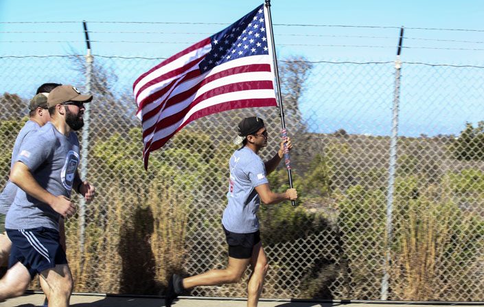 MSSA Camp Pendleton running with the American flag