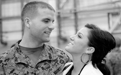 A Marine returning from his first deployment next to his wife.