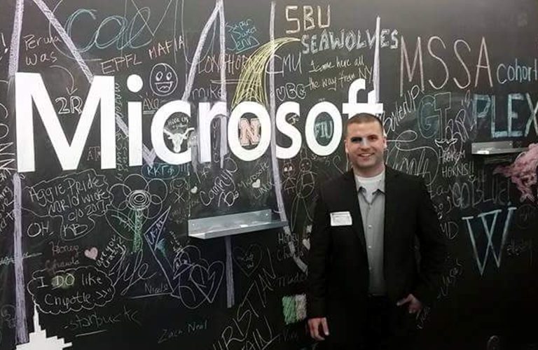 Marine standing next to the interview board used to pass the time waiting for interviews