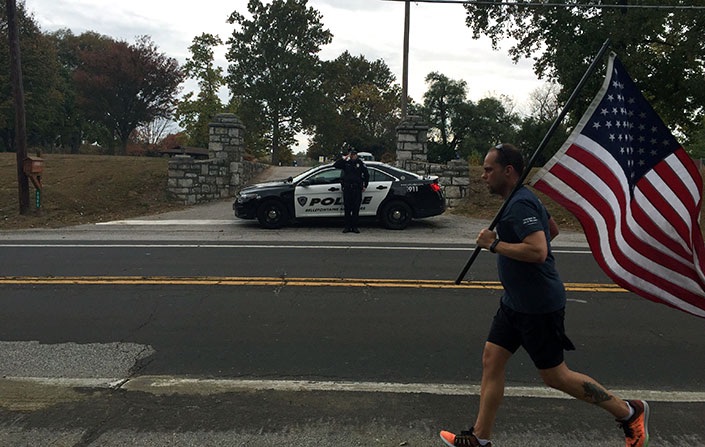 Police Officer shows respect during the Old Glory relay.