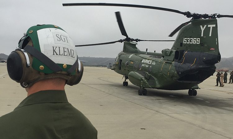 Sergeant Klemz overlooking a helicopter