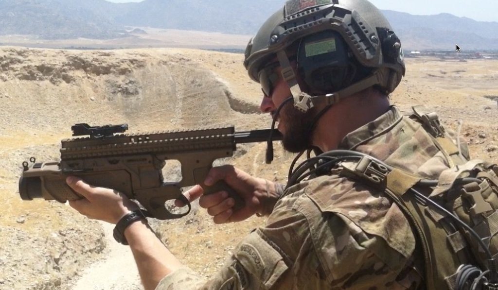 Special forces soldier overseas firing weapon.