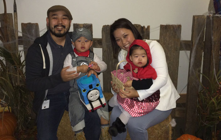 Anthony Seo poses for a picture with his family during a Halloween party in Redmond, WA.