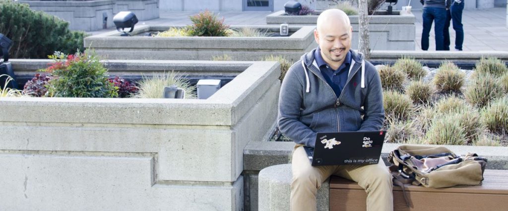 Marine Corps veteran, Anthony SEO, sitting and working on his computer.