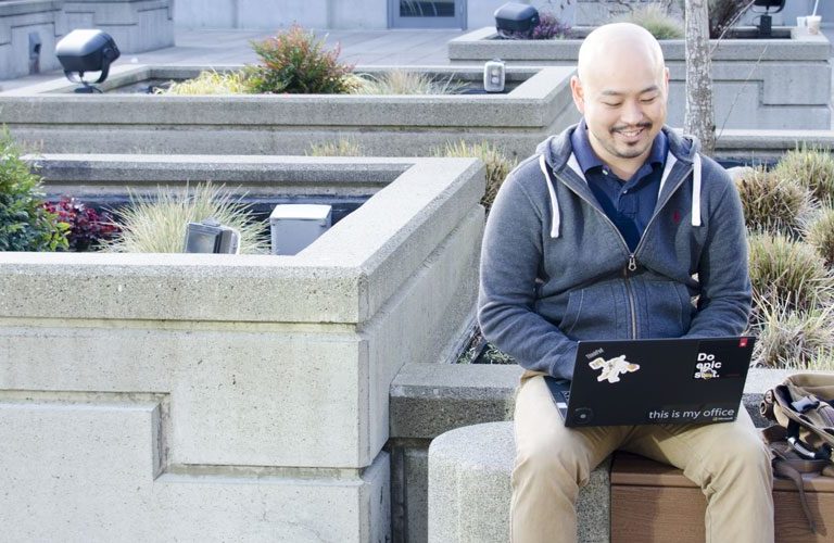 Marine Corps veteran, Anthony SEO, sitting and working on his computer.