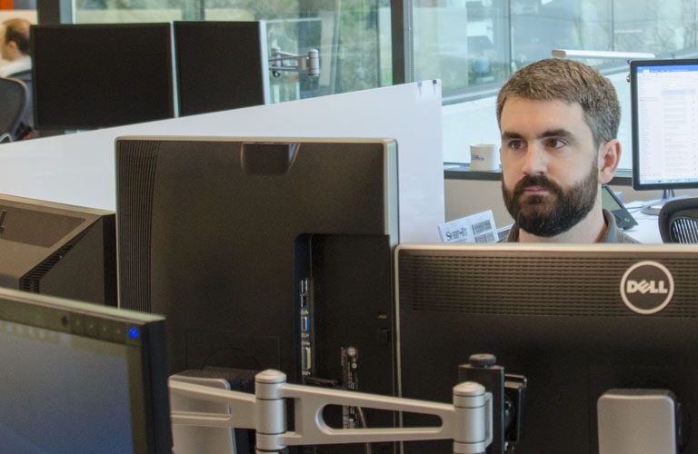 Mark looking at his computer.