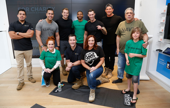 Group photo of the participants who competed in the Pushups for Charity event at Microsoft's Flagship Store in New York.