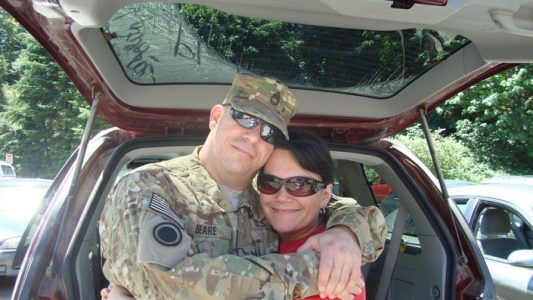 Robert Beare with his wife before his deployment.